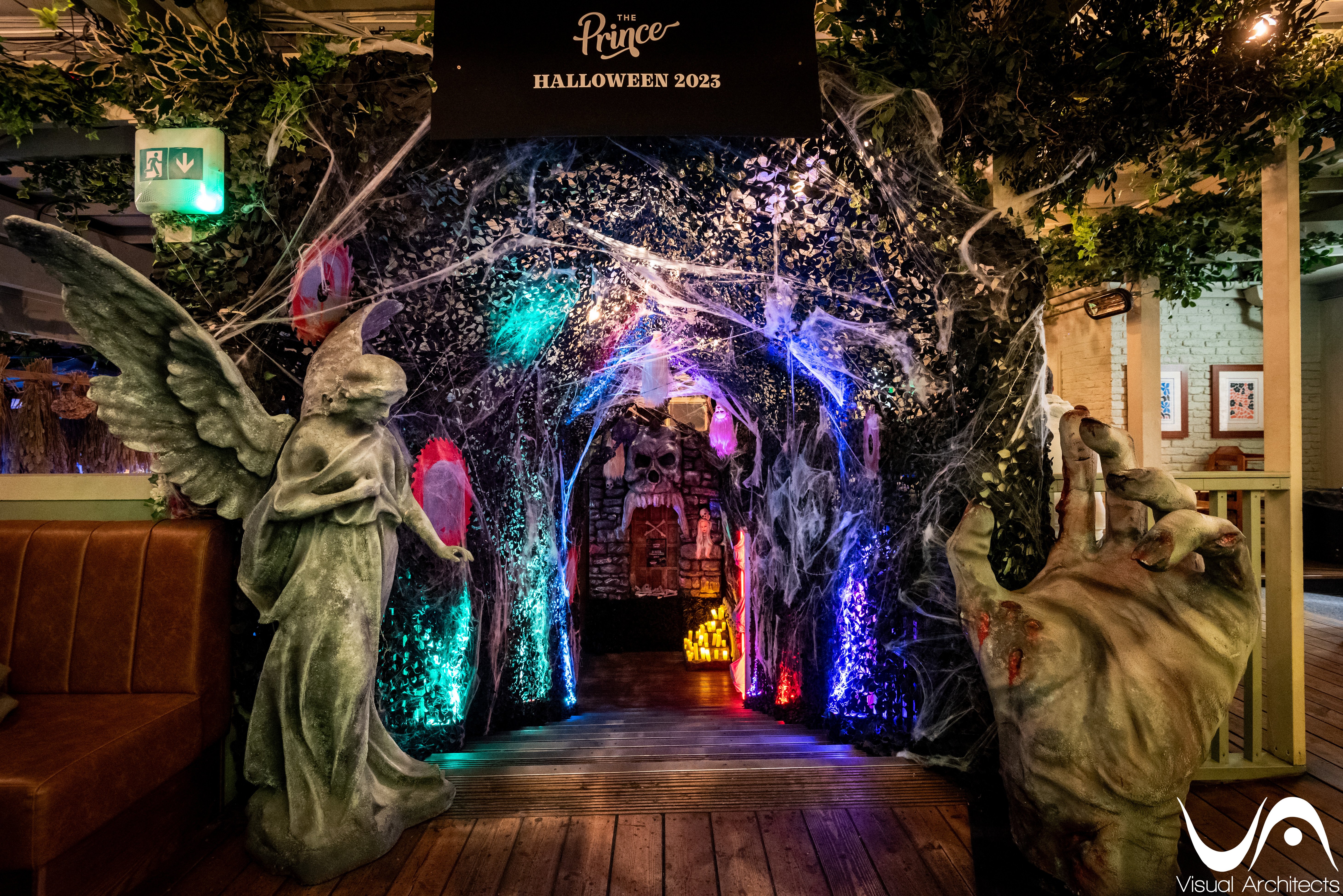 Spooky entrance at Prince Bar designed by Visual Architects featuring grim reapers and skull setup